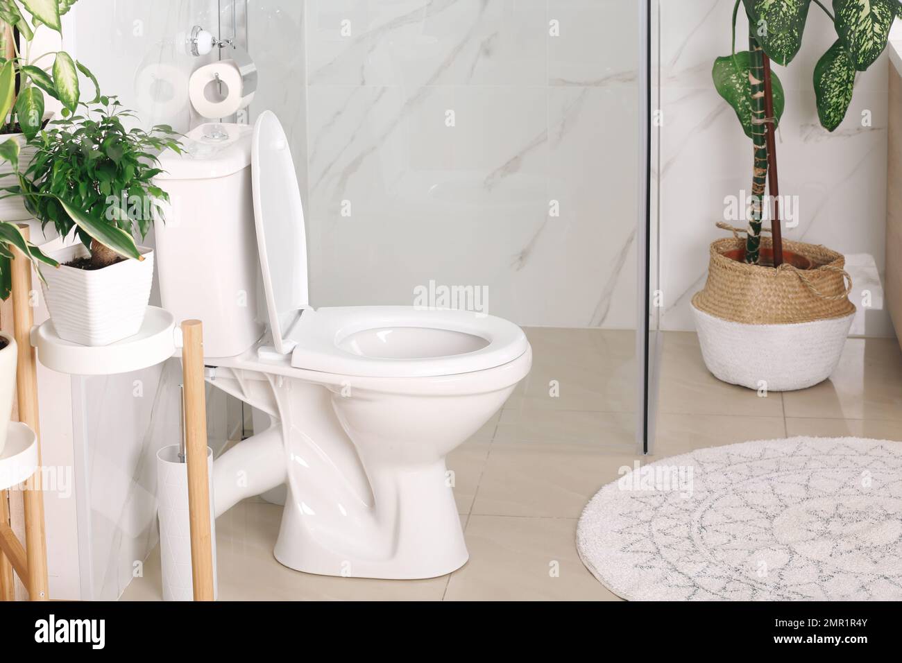 Stylish toilet bowl in modern bathroom interior Stock Photo - Alamy