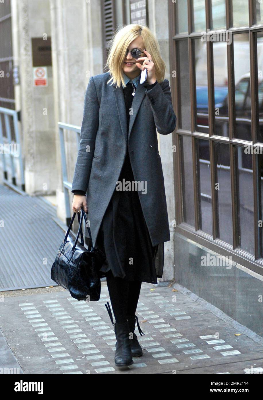 Fearne Cotton looks very business like in a grey 3 4 length coat
