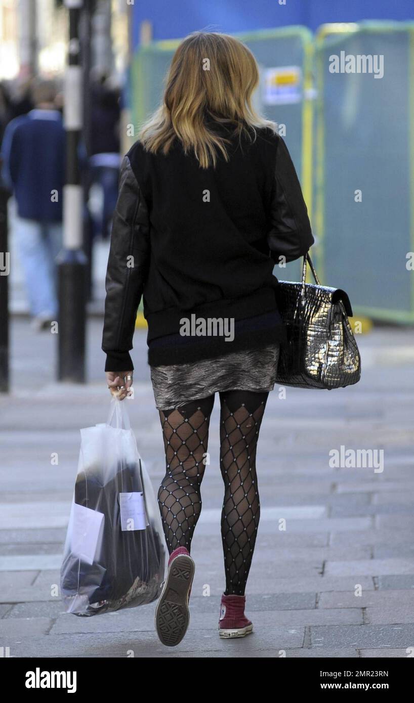 https://c8.alamy.com/comp/2MR23RN/wearing-a-frumpy-looking-outfit-dj-fearne-cotton-leaves-bbc-radio-1-sporting-a-rip-in-the-back-of-her-tights-london-uk-2811-2MR23RN.jpg