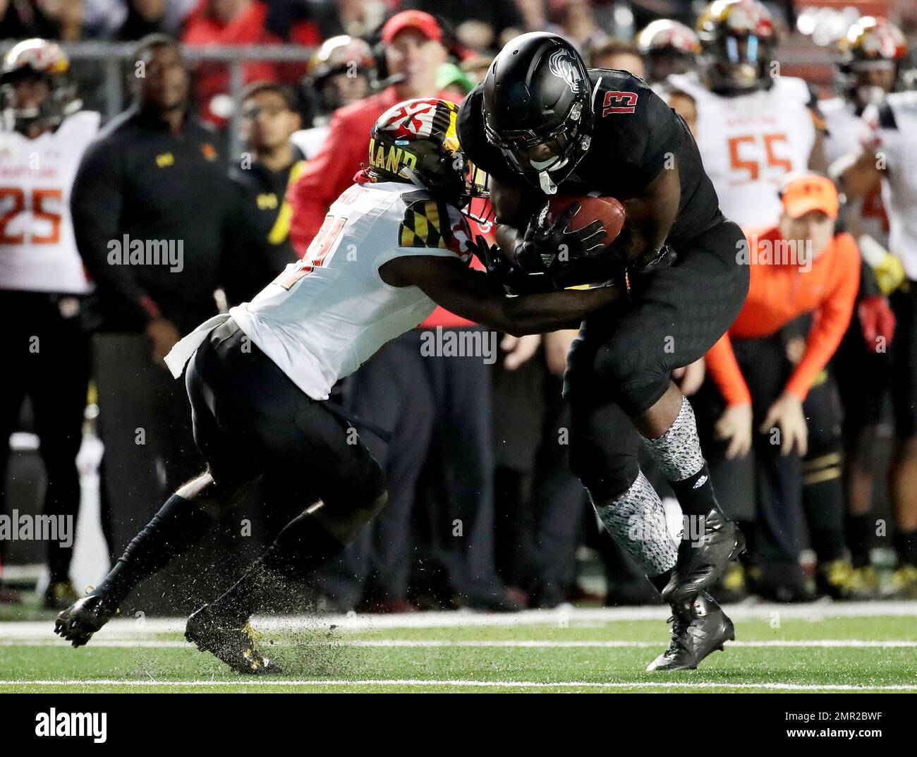 Rutgers running back Gus Edwards, right, makes a move before avoiding a  tackle by Maryland defensive back RaVon Davis on his way to score a  touchdown during the second half of an