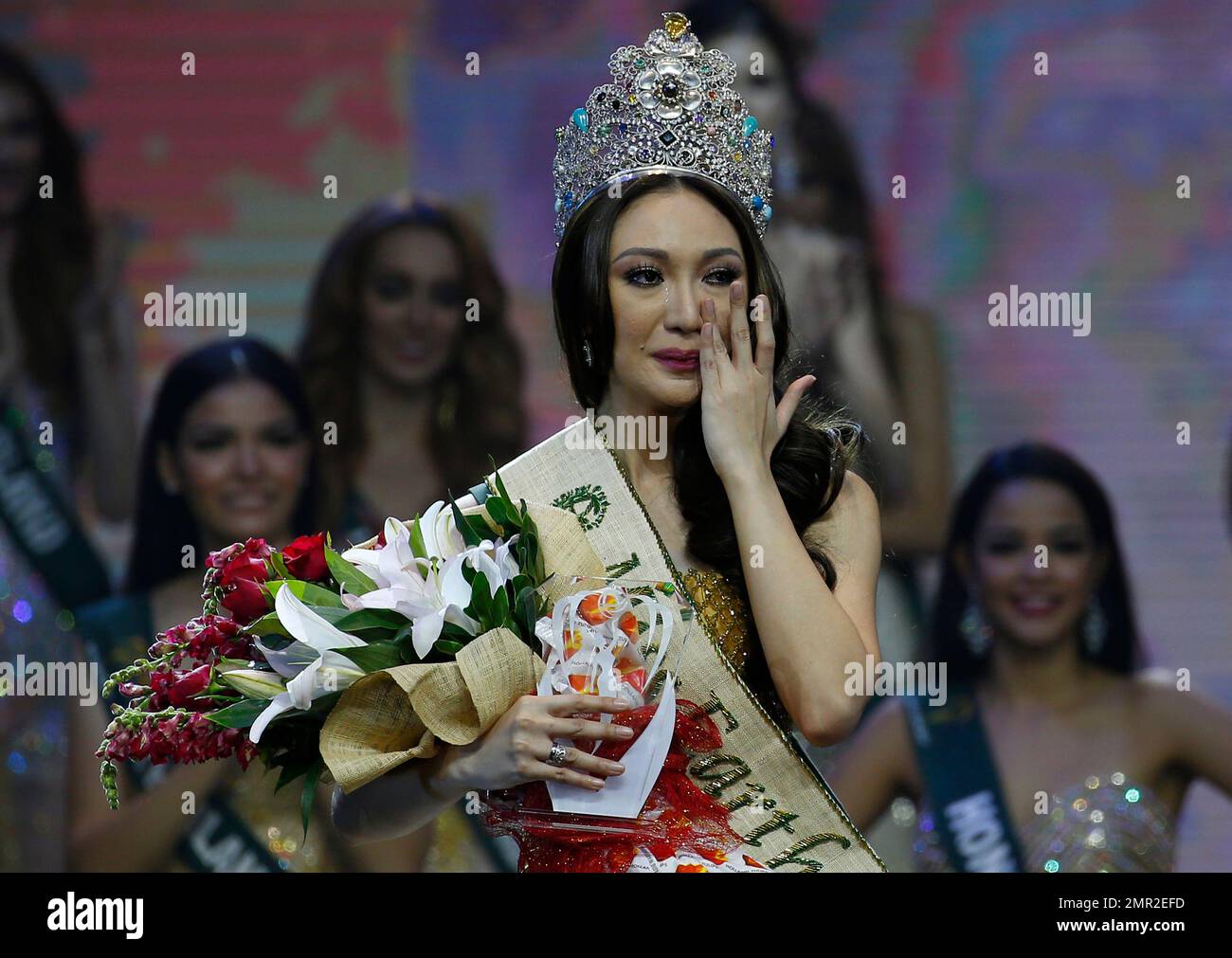 Karen Ibasco of the Philippines wipes her tears shortly after being ...