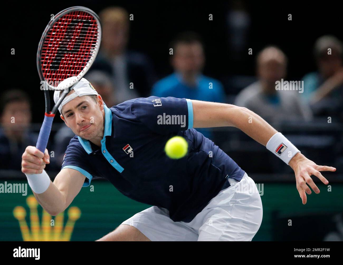 John Isner of the United States returns the ball to Filip Krajinovic of  Serbia during their semifinal match of the Paris Masters tennis tournament  at the Bercy Arena in Paris, France, Saturday,