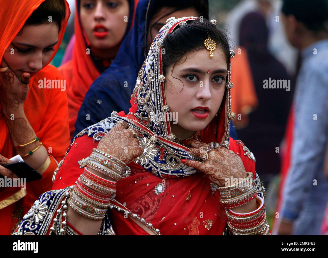 A Sikh girl arrives to attend a religious festival celebrating the