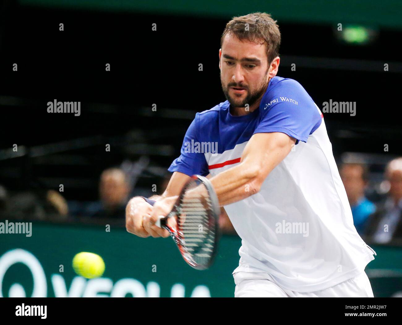 Marin Cilic of Croatia returns the ball to Julien Benneteau of France  during their quarterfinal match of the Paris Masters tennis tournament at  the Bercy Arena in Paris, France, Friday, Nov. 3,