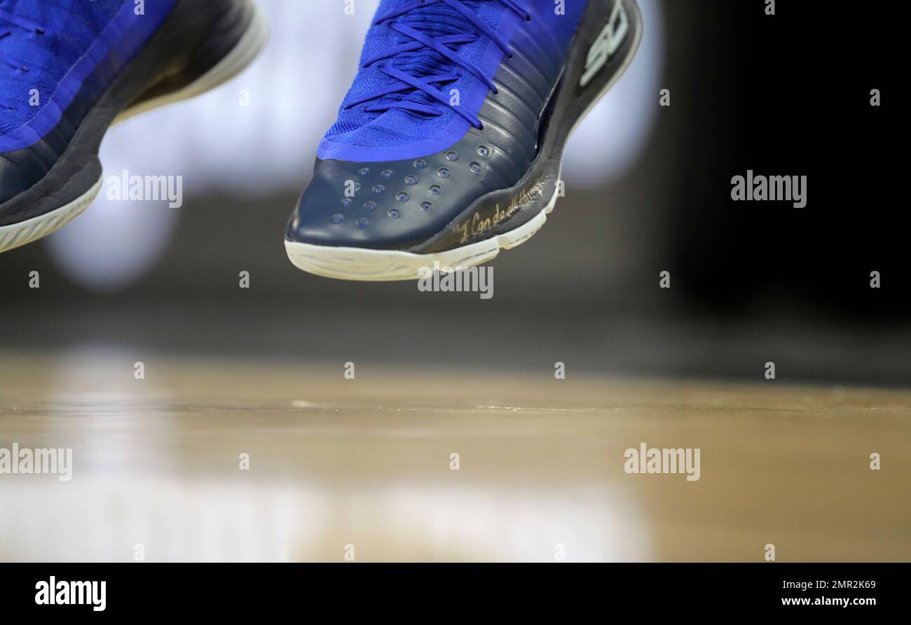 A partial scripture is seen on the shoe of Golden State Warriors guard  Stephen Curry before an NBA basketball game against the San Antonio Spurs,  Thursday, Nov. 2, 2017, in San Antonio. (
