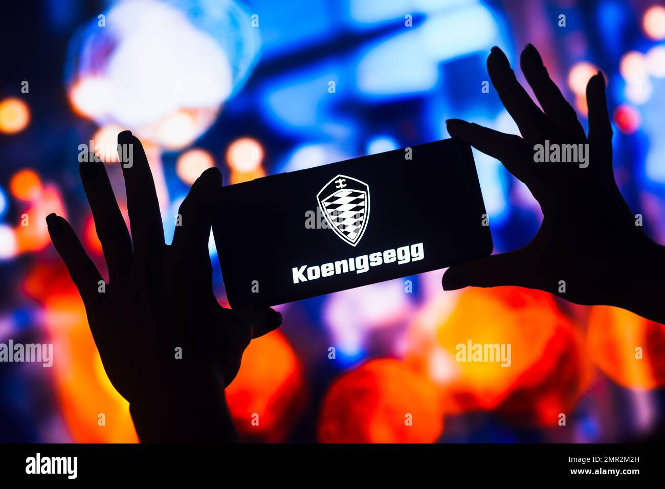 In this photo illustration, the Koenigsegg Automotive AB logo is