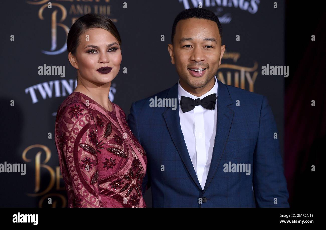 FILE - In this March 2, 2017 file photo, Chrissy Teigen, left, and John  Legend arrive at the world premiere of 