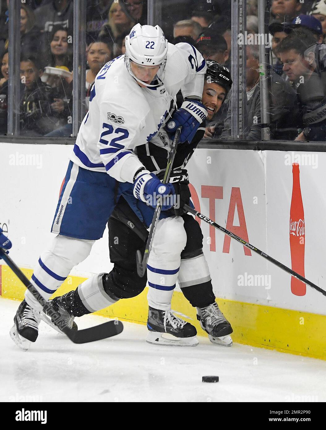 Toronto Maple Leafs defenseman Nikita Zaitsev, left, of Russia, and Los Angeles Kings center Alex Iafallo watch the puck during the second period of an NHL hockey game, Thursday, Nov