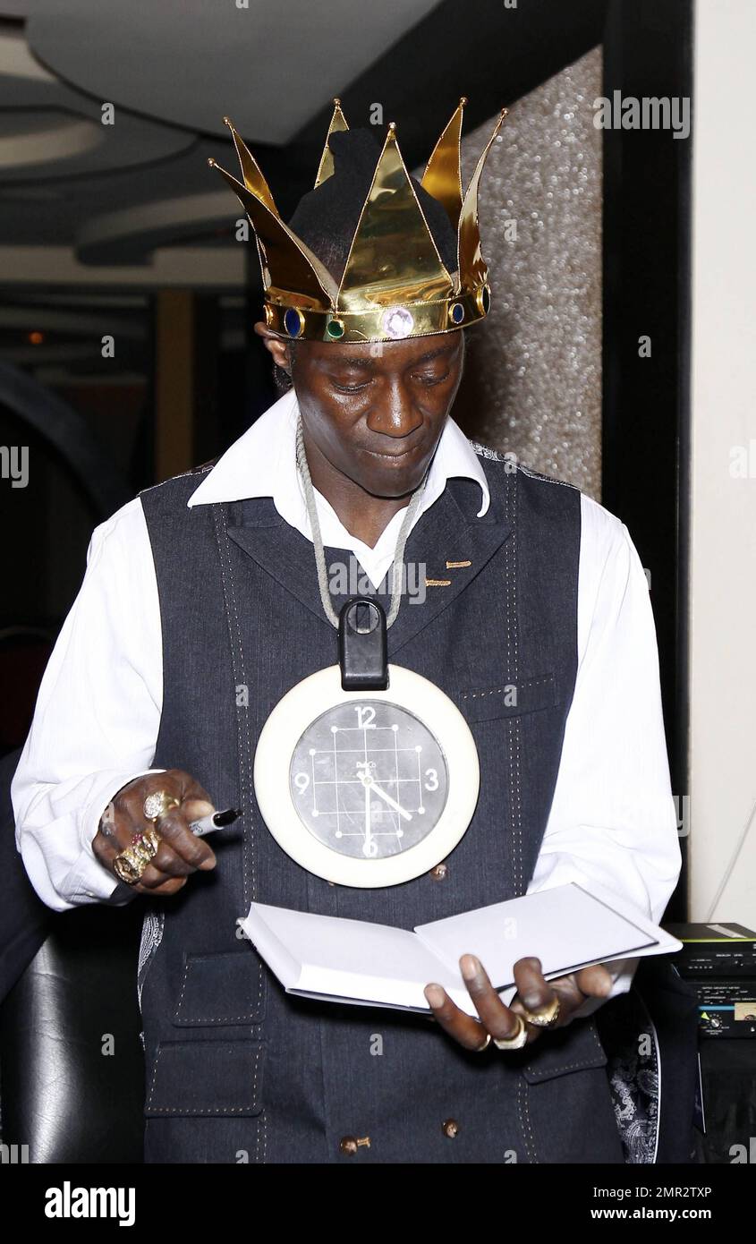 Flavor Flav signs his new book, “Flavor Flav The Icon The Memoir”, at