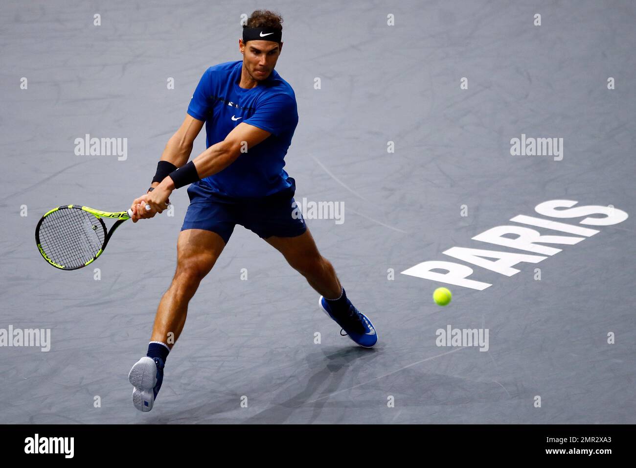 Rafael Nadal of Spain returns the ball to Pablo Cuevas of Uruguay during  the third round of the Paris Masters tennis tournament at the Bercy Arena  in Paris, France, Thursday, Nov. 2,