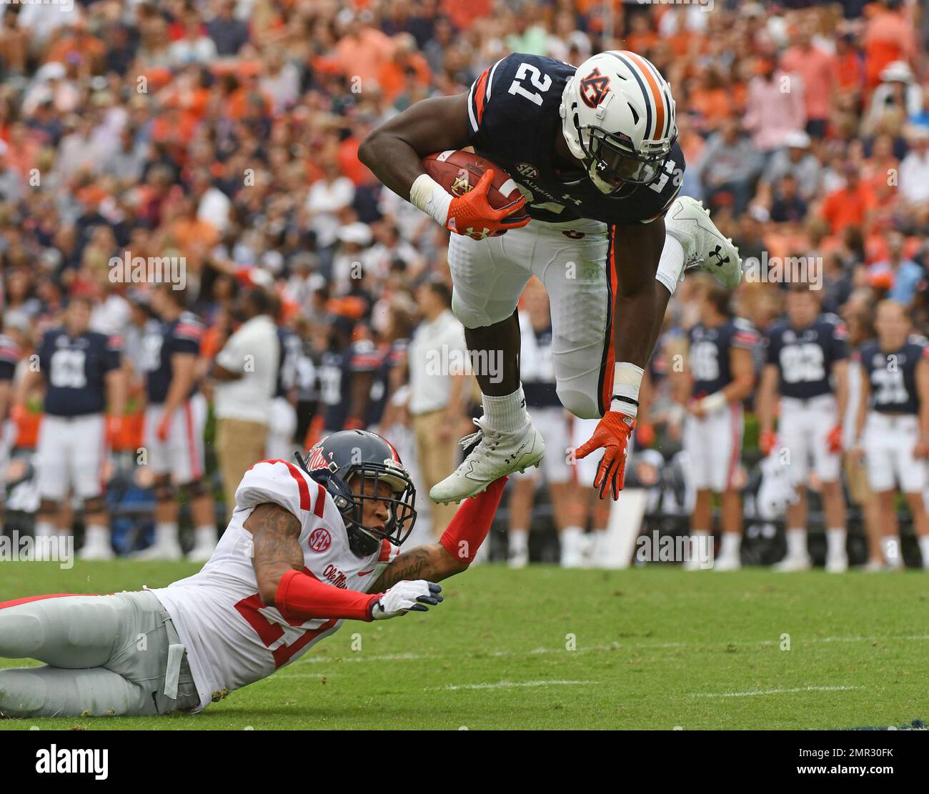 FILE - In this Oct. 7, 2017, file photo, Mississippi defensive back Javien  Hamilton (21) trips up Auburn running back Kerryon Johnson (21) during the  first half of an NCAA college football