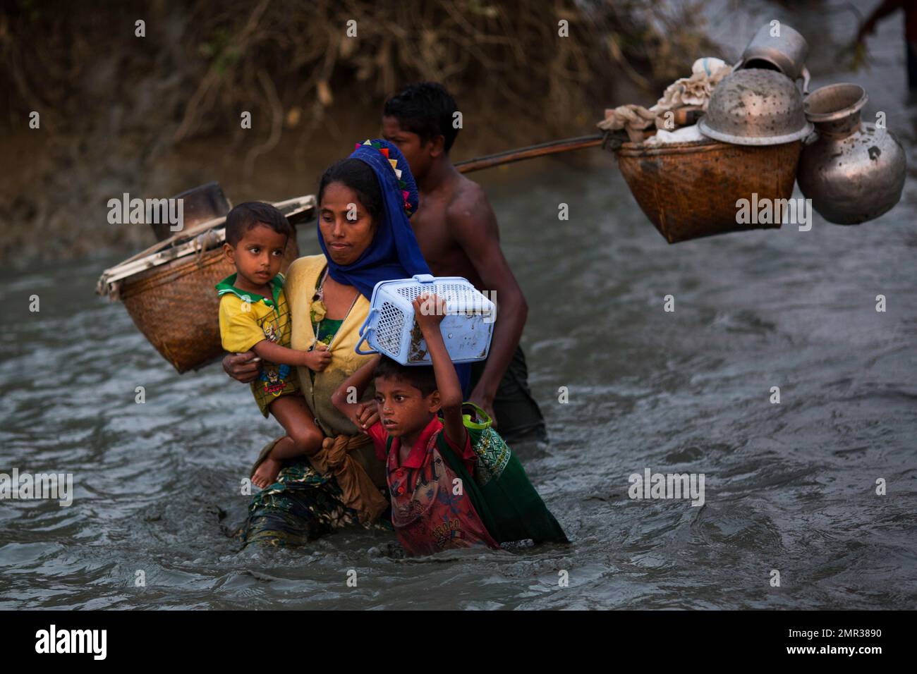 Rohingya Muslims cross the border from Myanmar into Bangladesh, near