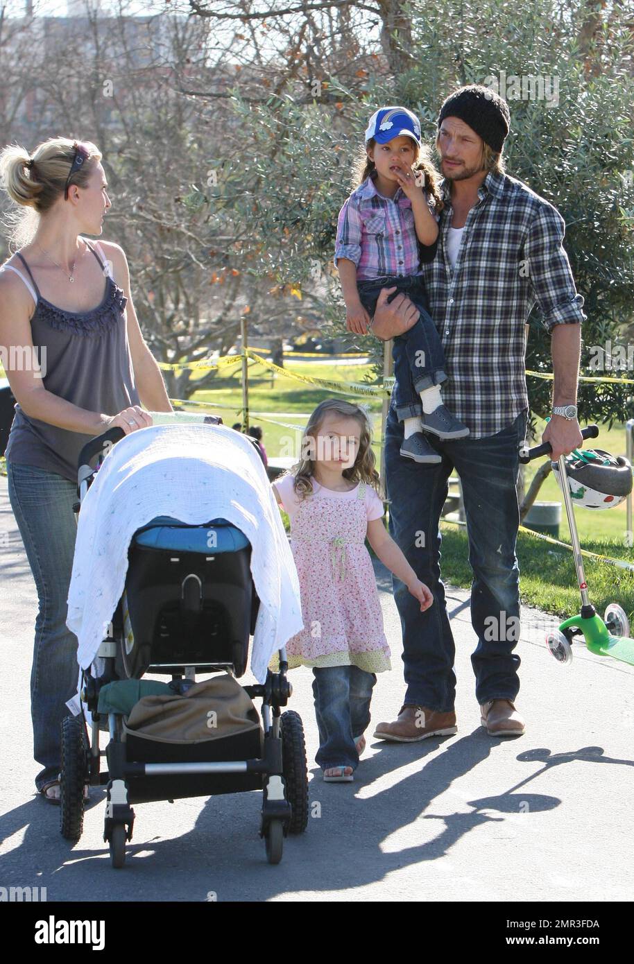 Wearing matching outfits, Gabriel Aubry and daughter Nahla spend a day  together at a local playground. Joined by a friend, little Nahla played on  the swings and her dad carried her while