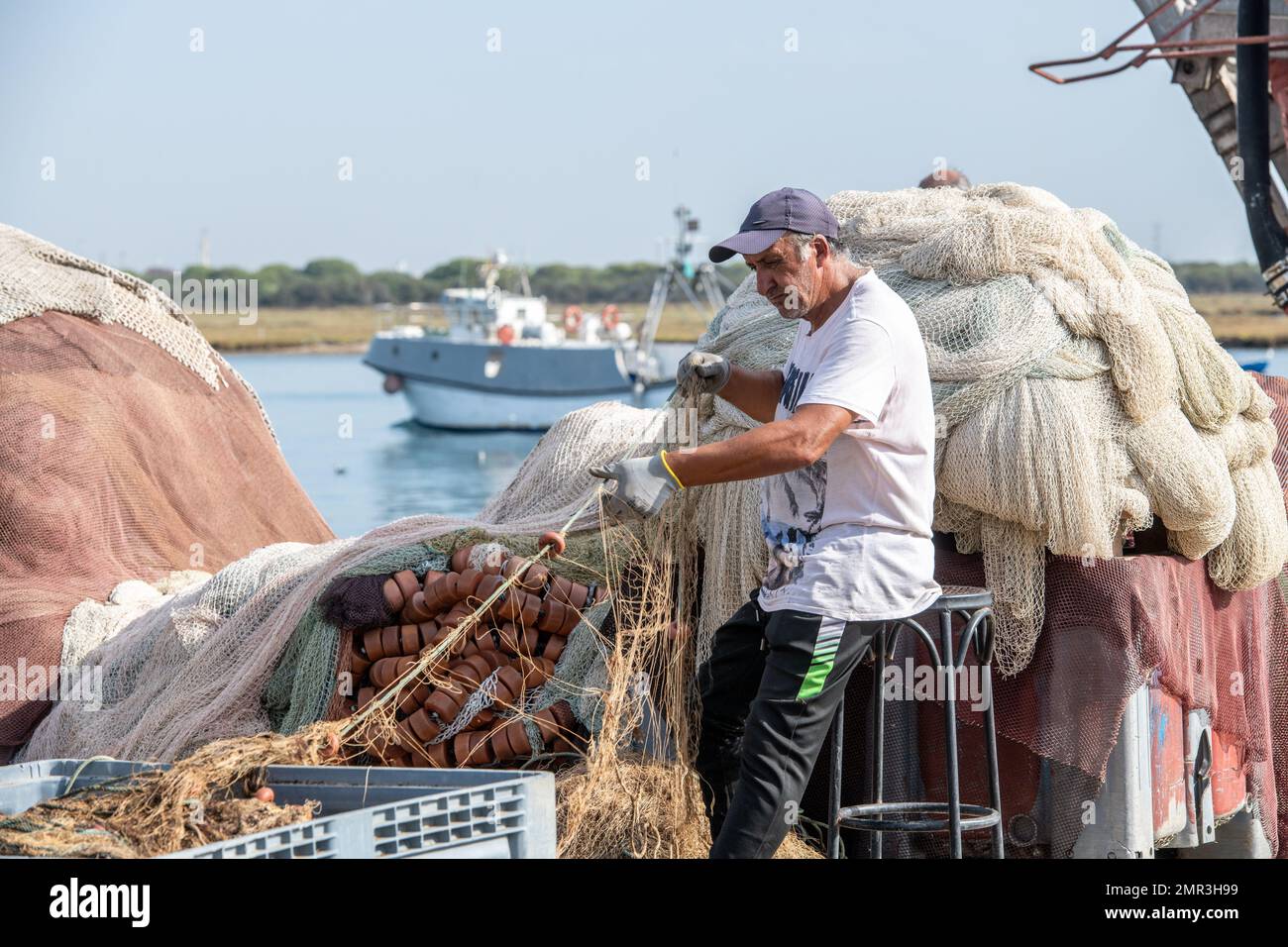 Untangling fishing nets hi-res stock photography and images - Alamy