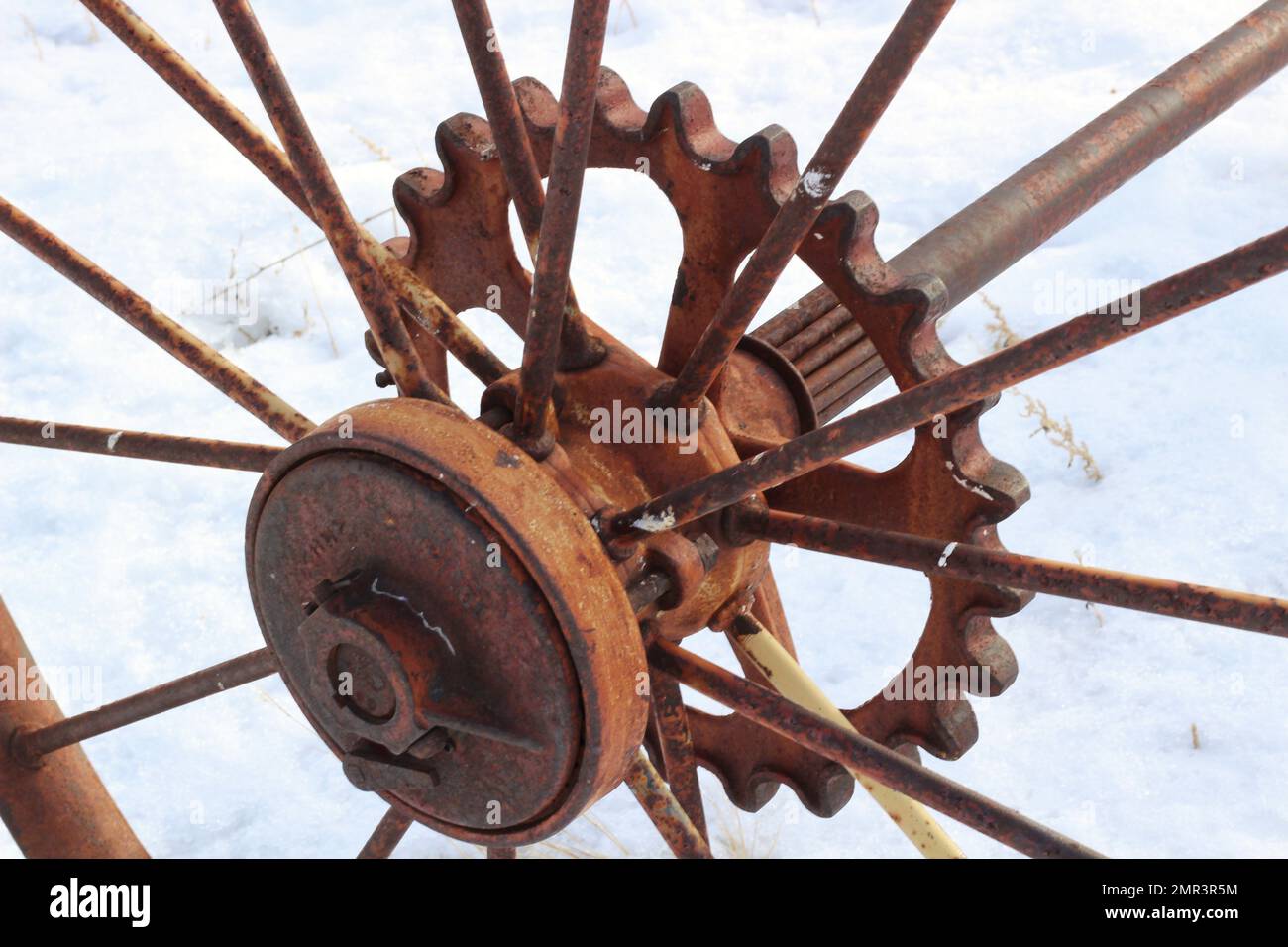 An old rusty sprocket gear from machinery that lifted hay to a wagon ...