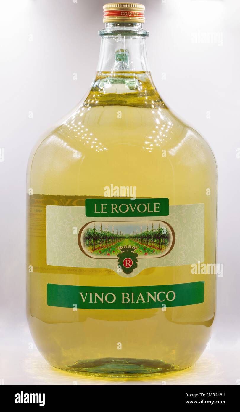 Kyiv, Ukraine - November 27, 2021: Studio shoot of Le Rovole white Italian dry wine 5 liter glass bottle closeup on white. Stock Photo