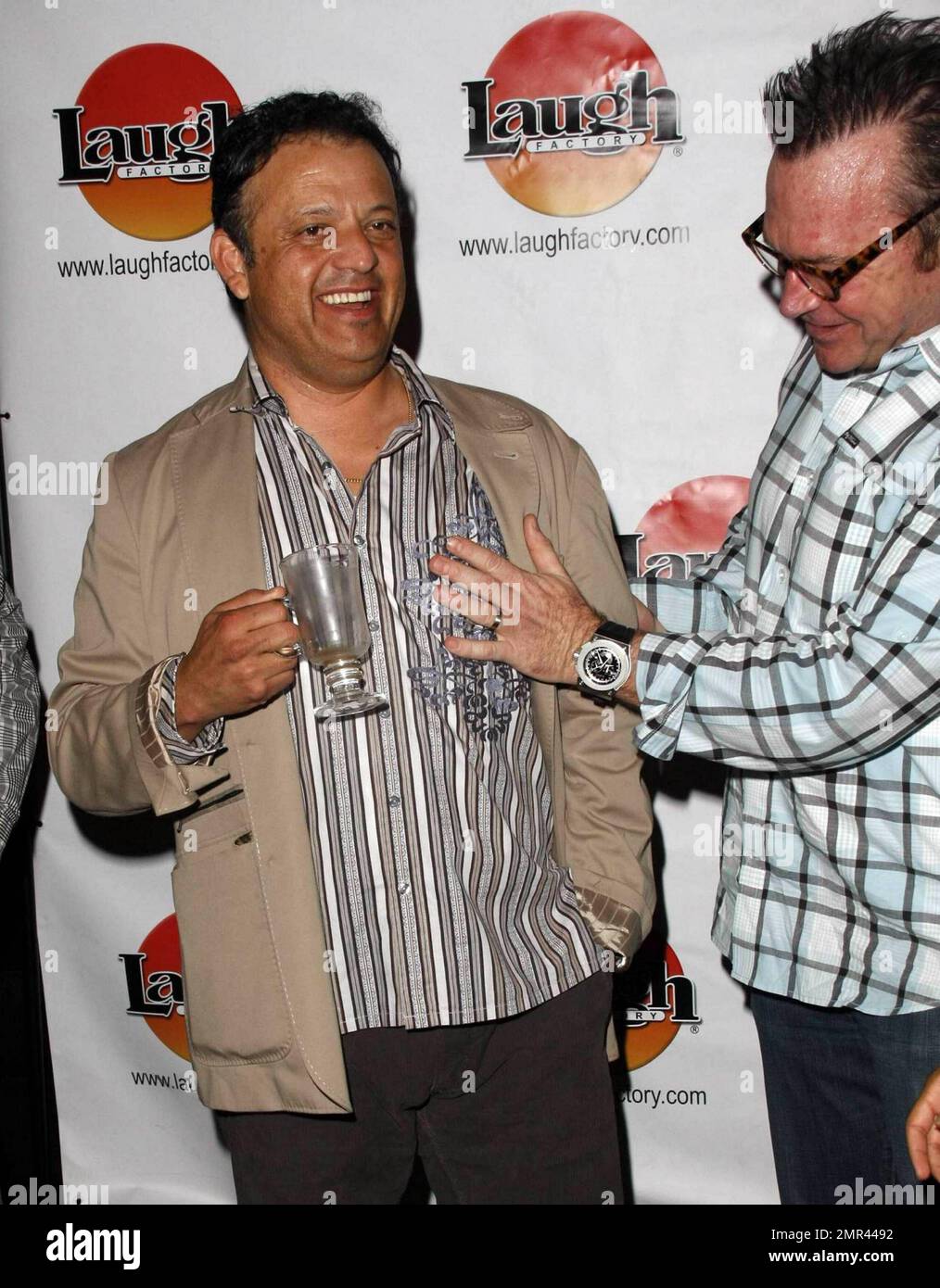 Tom Arnold and friends hosted posthumous 73rd Birthday celebration for George Carlin last night at the Laugh Factory. Tom is seen here with Paul Rodriguez. Los Angeles, CA. 5/13/10.    . Stock Photo