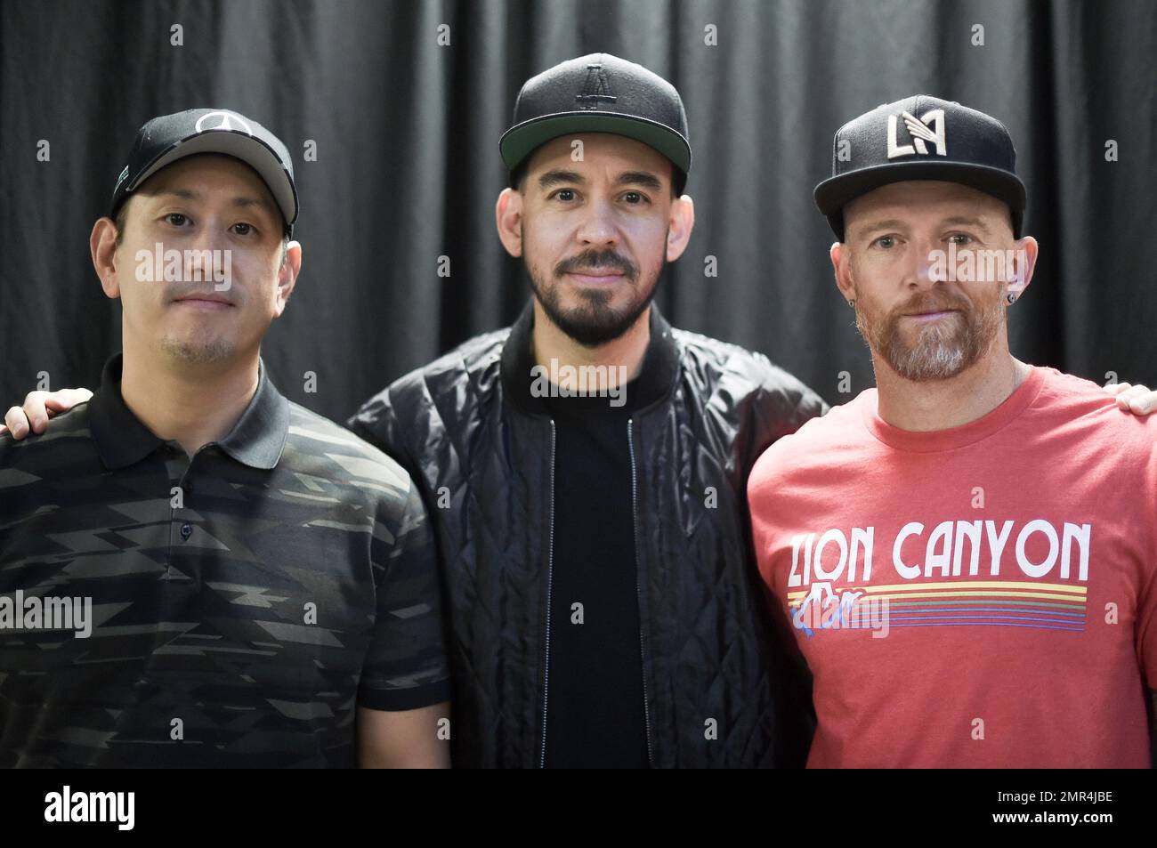 Joe Hahn, from left, Mike Shinoda and Dave Farrell pose backstage after