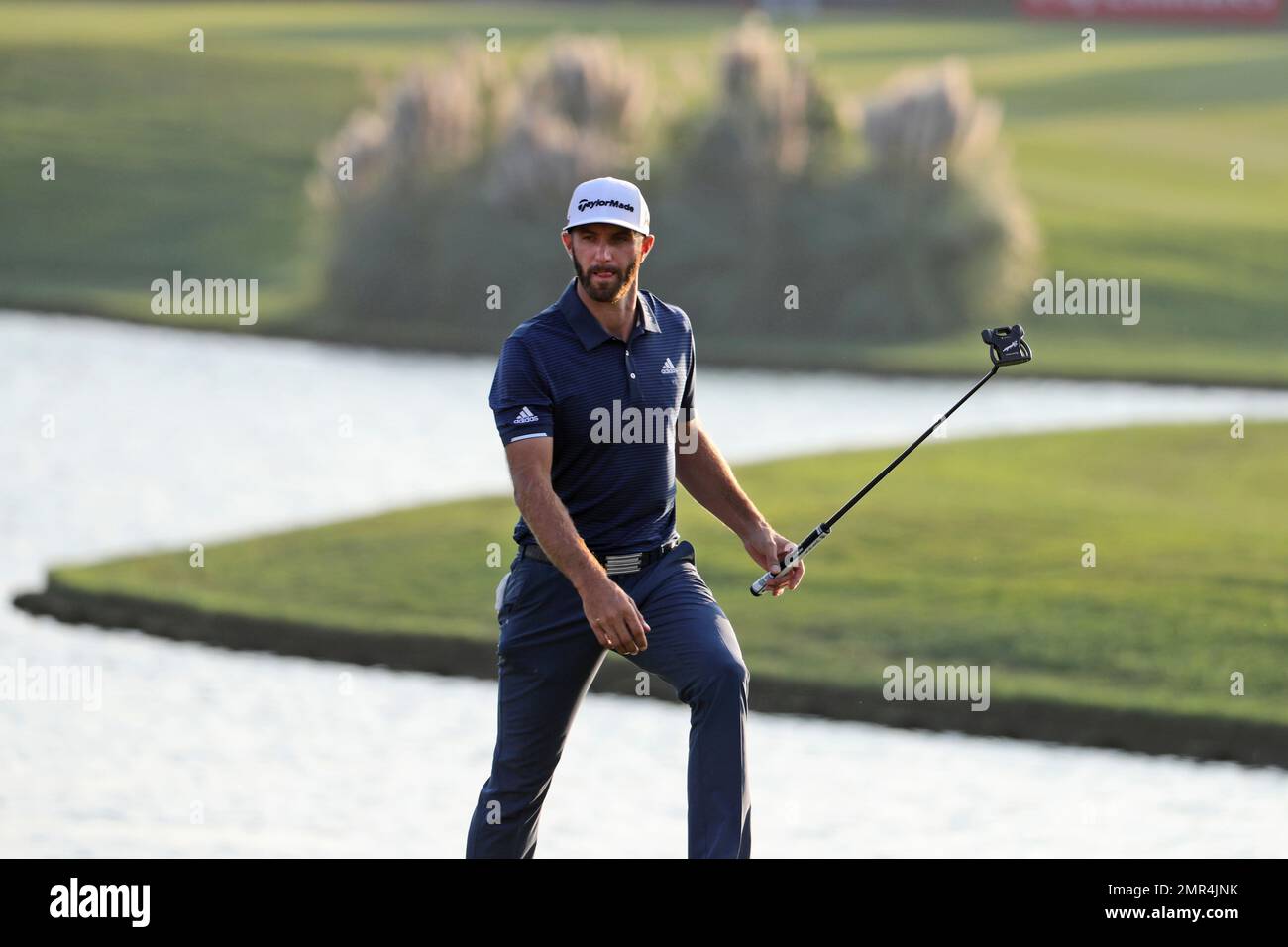 World number one golfer Dustin Johnson looks for his shot at the 18th hole  in round three of the 2017 WGC-HSBC Champions golf tournament held at the Sheshan  International Golf Club in