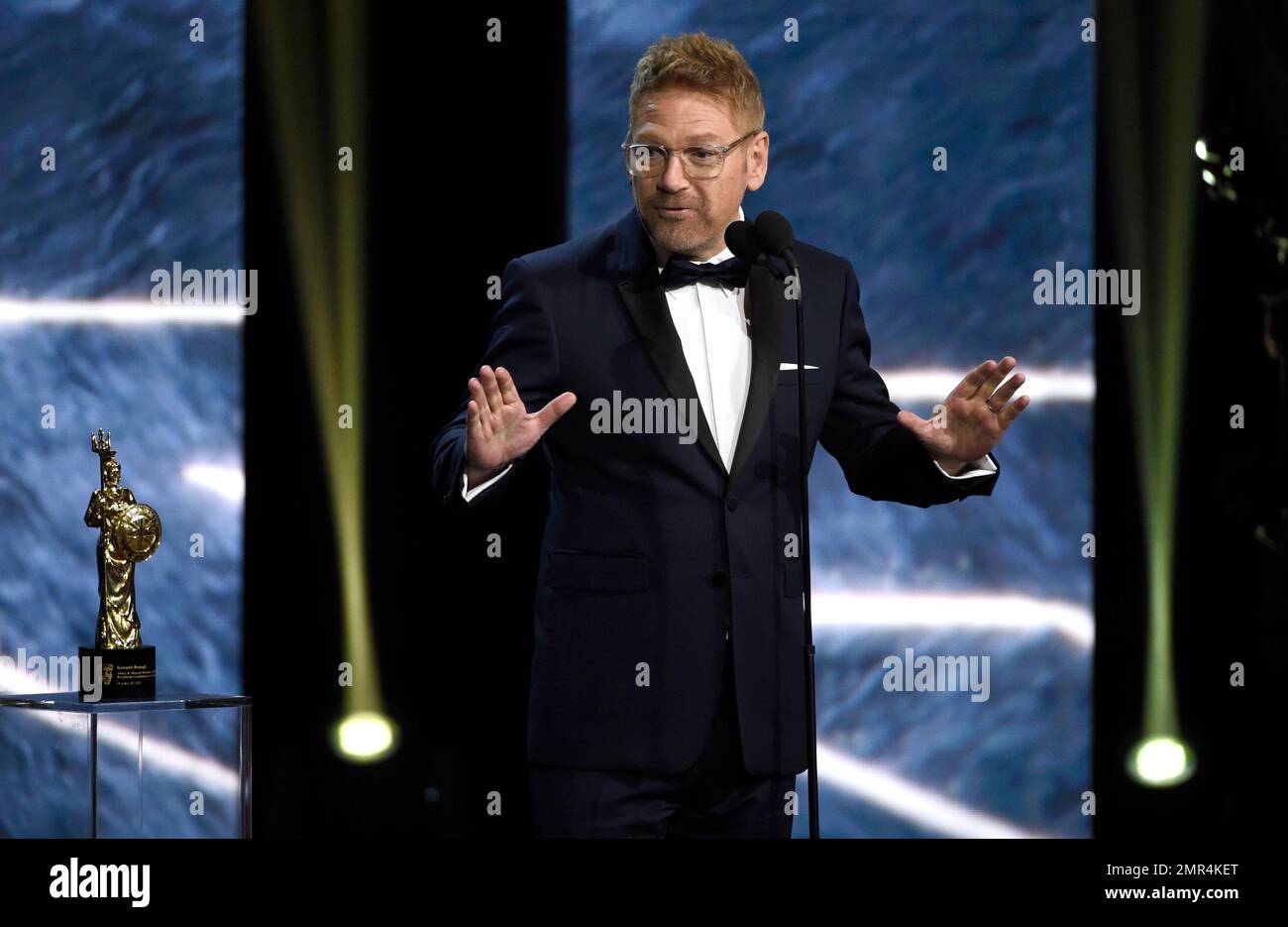 Kenneth Branagh accepts the Albert R. Broccoli award for worldwide ...