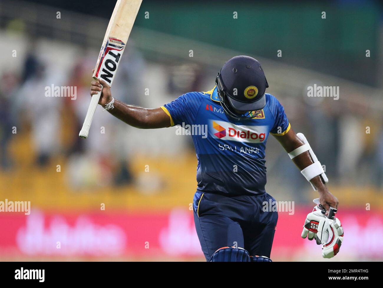 Sri Lanka's Dilshan Munaweera leaves the field after dismissal