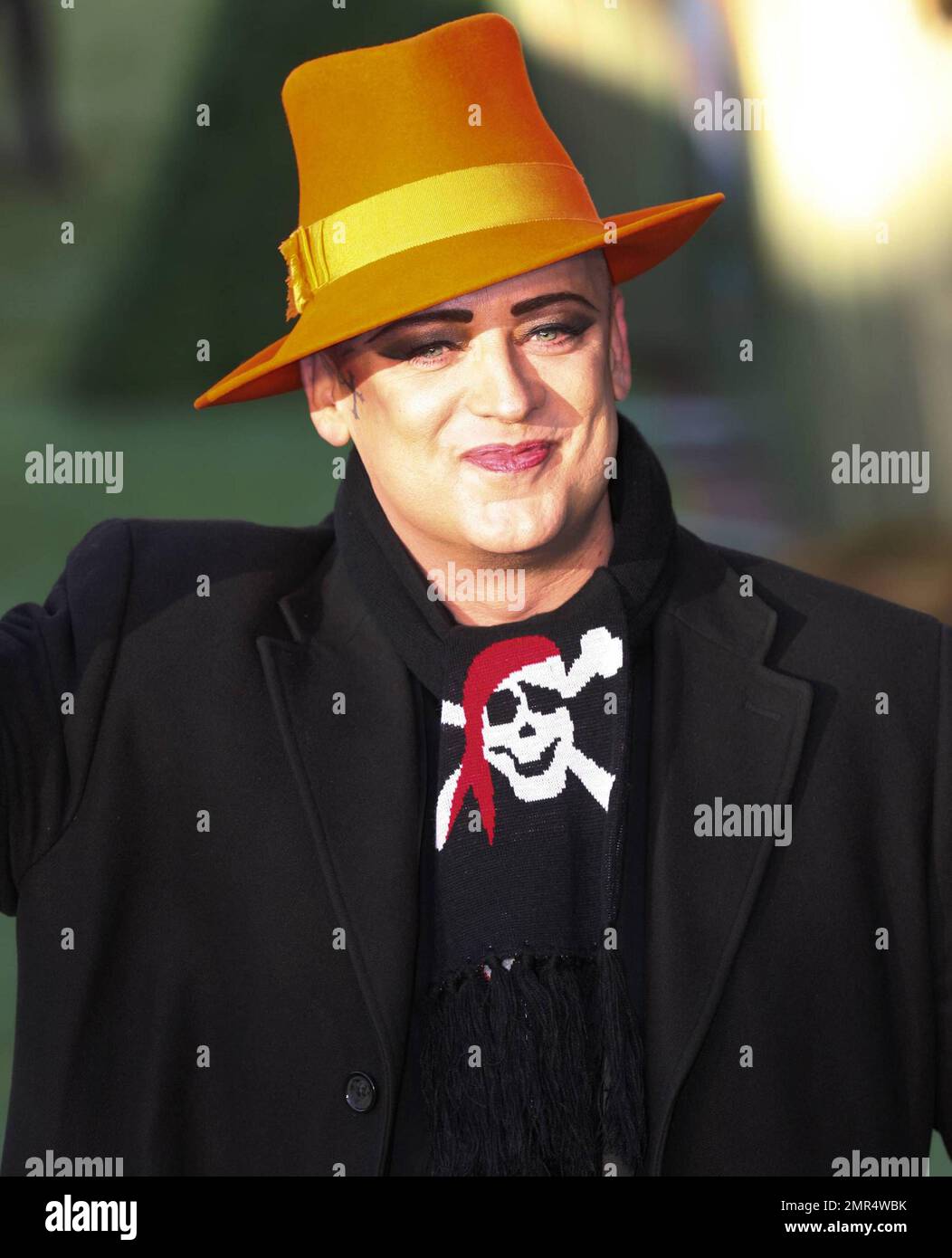 Boy (aka O'Dowd) wears an orange hat on the green carpet at the UK premiere of