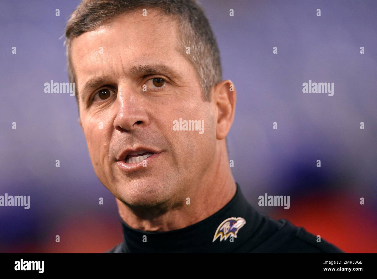 Baltimore Ravens Head Coach John Harbaugh Stands On The Field Before An ...