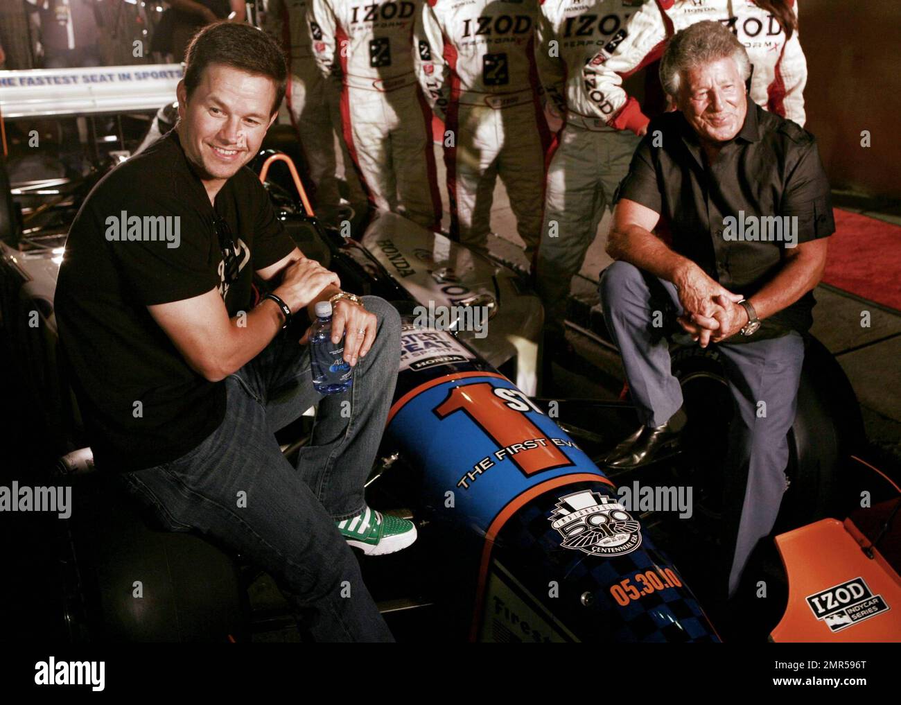 Mark Wahlberg and legendary race car driver Mario Andretti pose on a car at the GQ + Izod Indy 500 Dinner held at The Liberty Hotel hosted by Wahlberg. Boston, MA. 05/24/10. Stock Photo