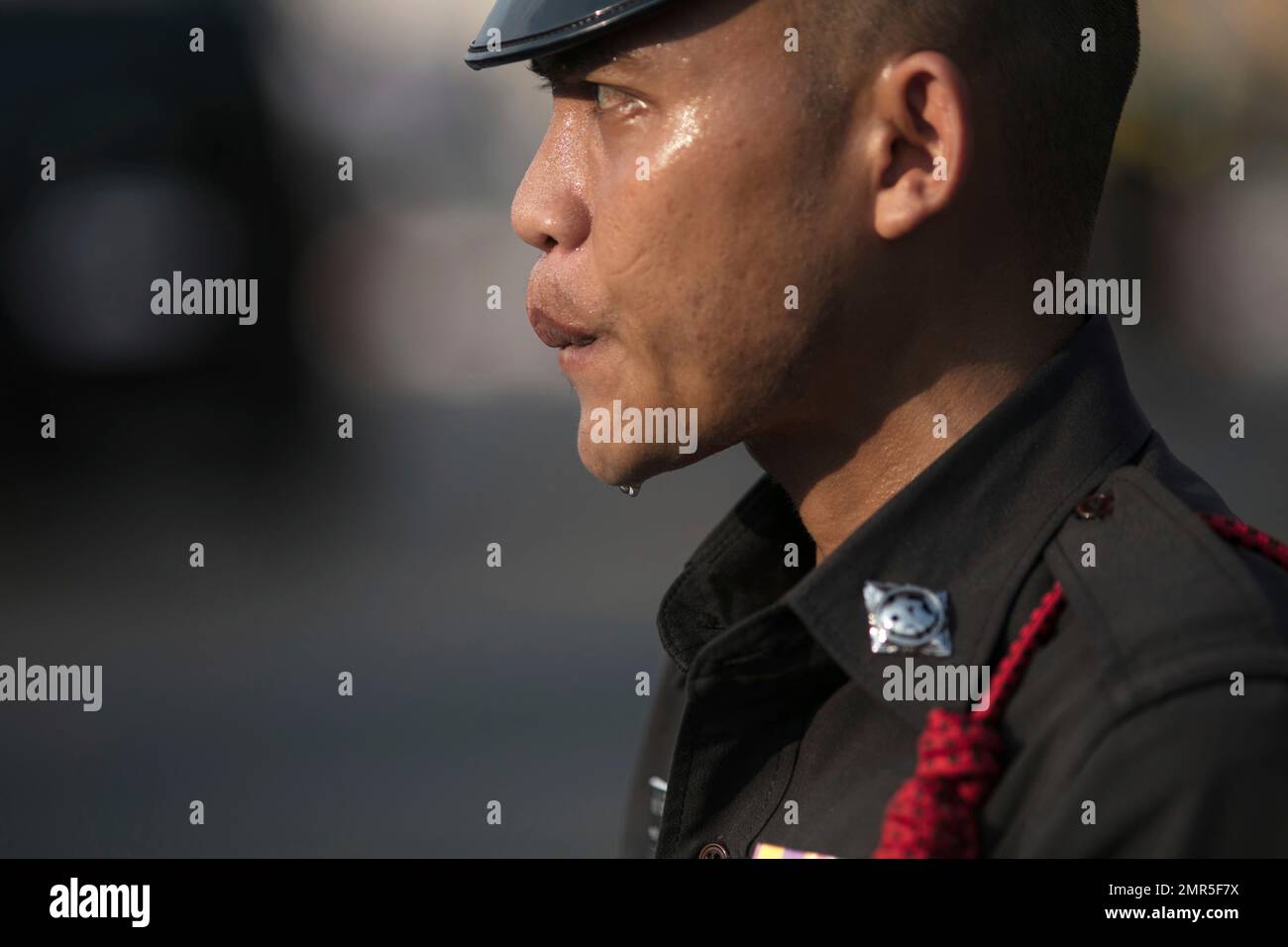Thai policeman stand guard outside Grand Palace where the body of the