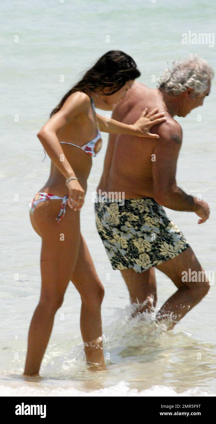 Exclusive!! Formula One Renault Boss Flavio Briatore and model girlfriend Elisabetta Gregoraci get playful on a recent trip to Florida. The pair got hot and heavy under the sun on Miami Beach and cooled off in the Ocean before returning to their hotel. Miami, Fla. 6/12/07. Stock Photo