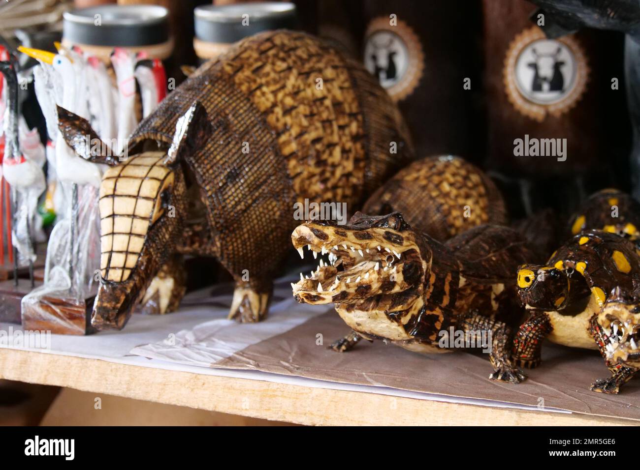 Animal curios made of wood, such as an armadillo, caiman, tortoise for sale at a curio stall. Location: Mercado Ver o Peso, Belem, State of Para, Amaz Stock Photo