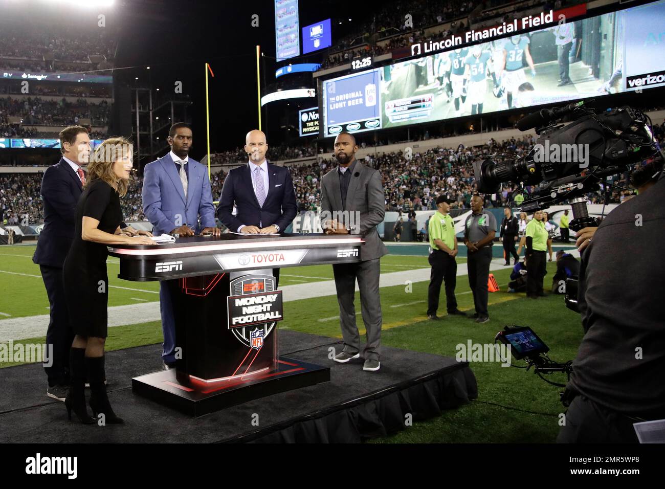 The cast of Monday Night Football, from left, Steve Young, Suzy Kolber