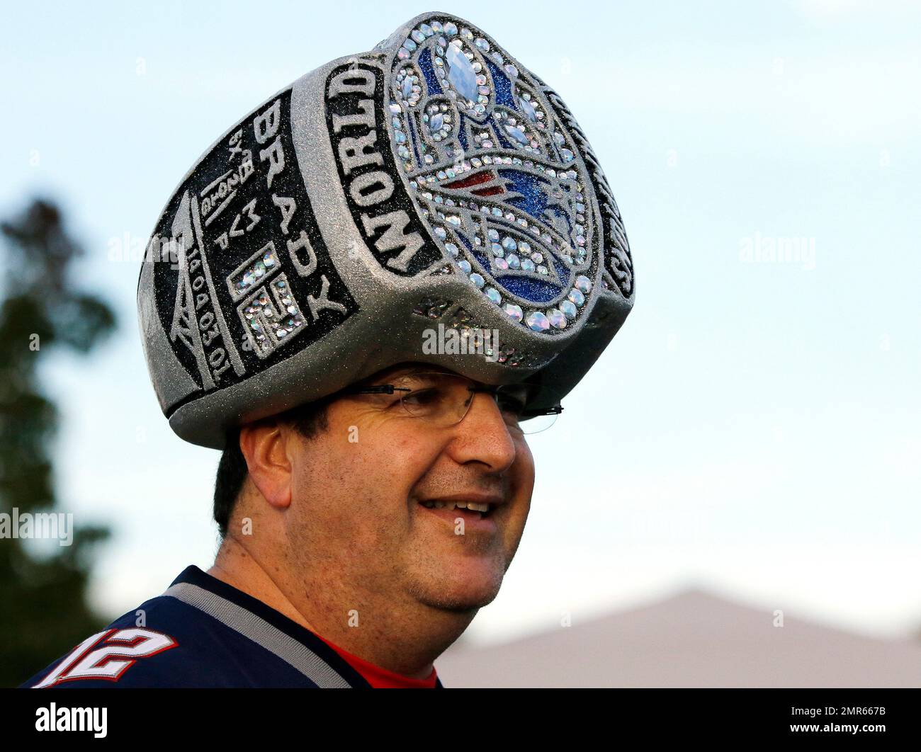 Mark Jawitz, of Andover, Mass., wears an oversized replica of a Super Bowl  champions ring as a hat while tailgating in the parking lot of Gillette  Stadium before an NFL football game