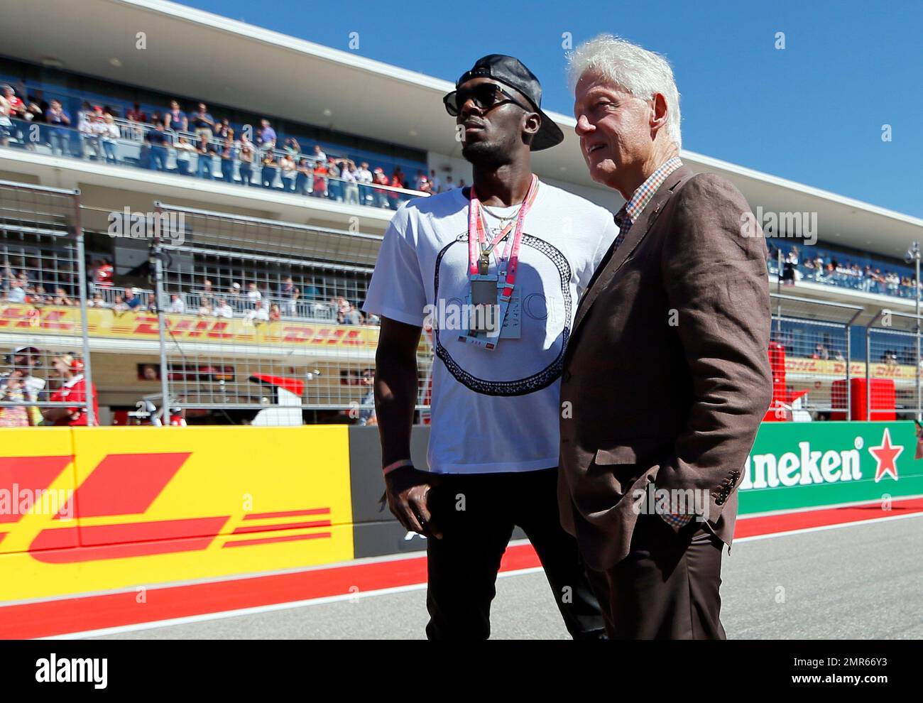 William Clinton Racing Sprinter Usain Bolt, left, and former President Bill Clinton stand on ...