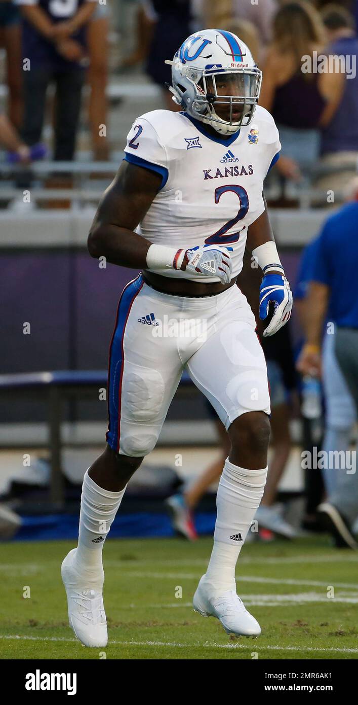 Kansas defensive end Dorance Armstrong Jr. (2) warms up before playing