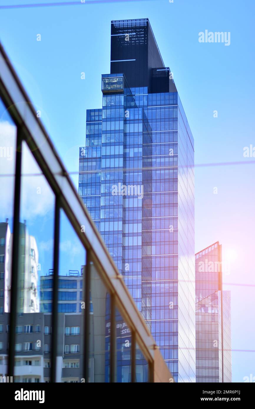 Abstract closeup of the glass-clad facade of a modern building covered ...