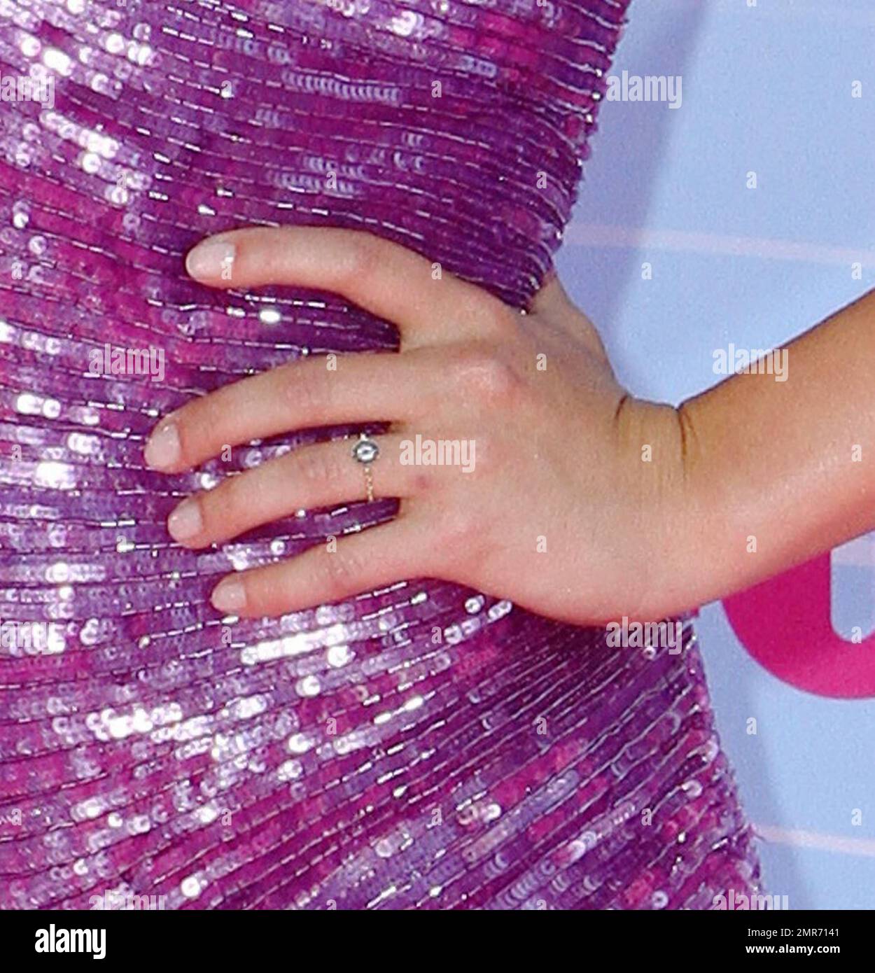 Hayden Panettiere wears a pink dress with multi colored animal print heels  and accessorized with rings on each hand at the 2012 Teen Choice Awards at  the Gibson Amphitheatre. Los Angeles, CA.