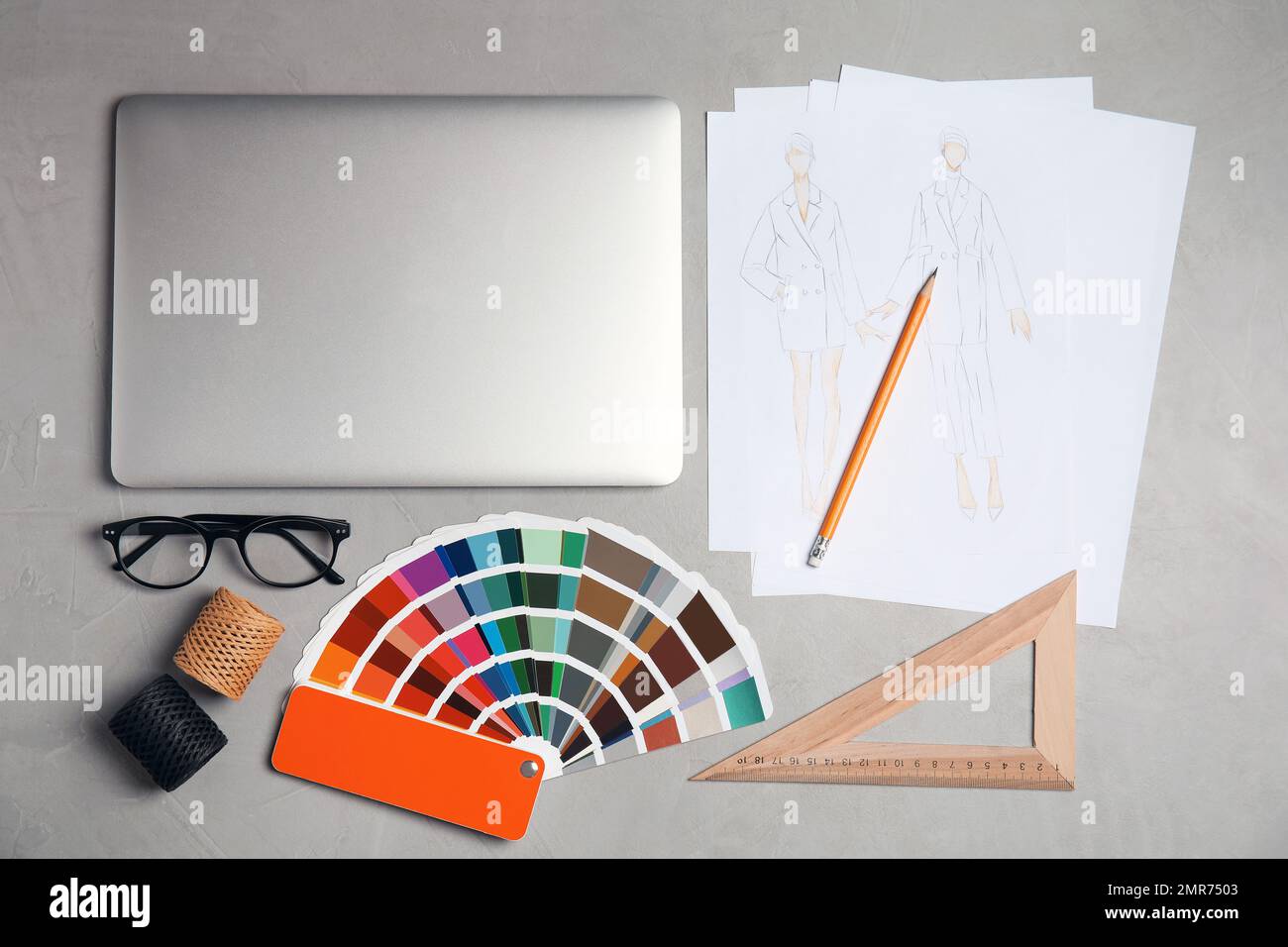 Flat lay composition with laptop and color palette on grey stone table ...