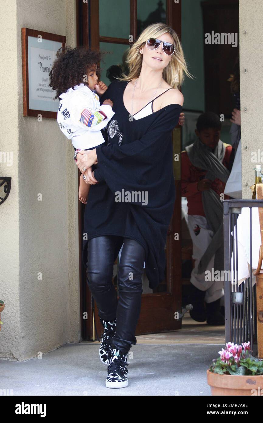 'Project Runway' host Heidi Klum was spotted leaving a restaurant in(02)