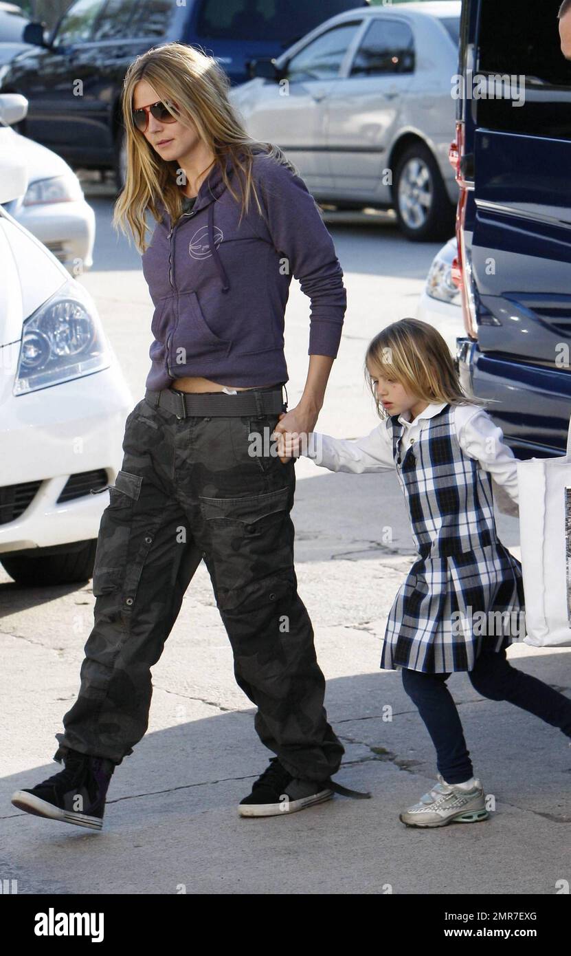 Top model Heidi Klum keeps it casual in camouflage cargo pants, hoodie and  high-top sneakers as she brings daughter Leni to a karate school where they  picked up Heidi's son Henry. Los
