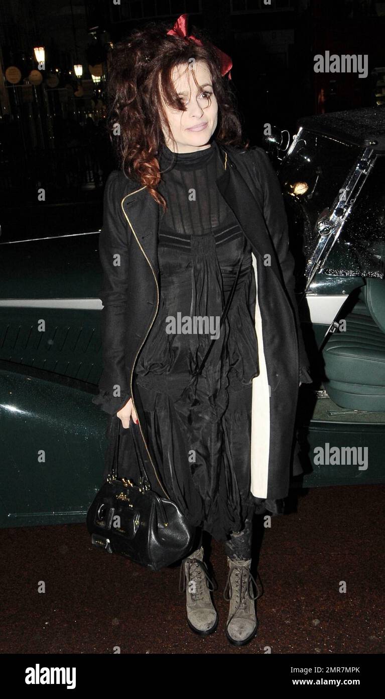 Actress Helena Bonham Carter dons a black dress, black ruffled jacket