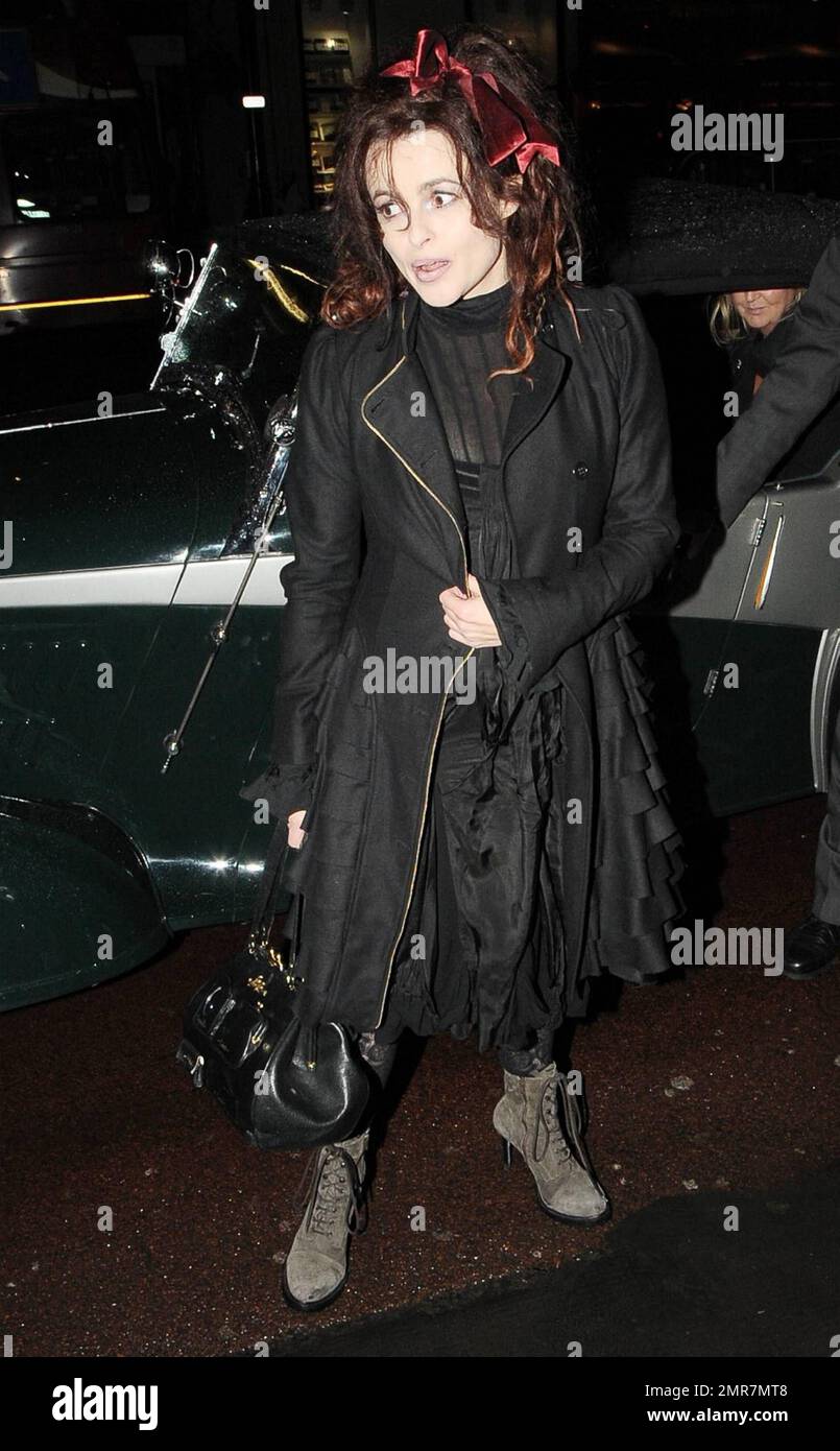 Actress Helena Bonham Carter dons a black dress, black ruffled jacket