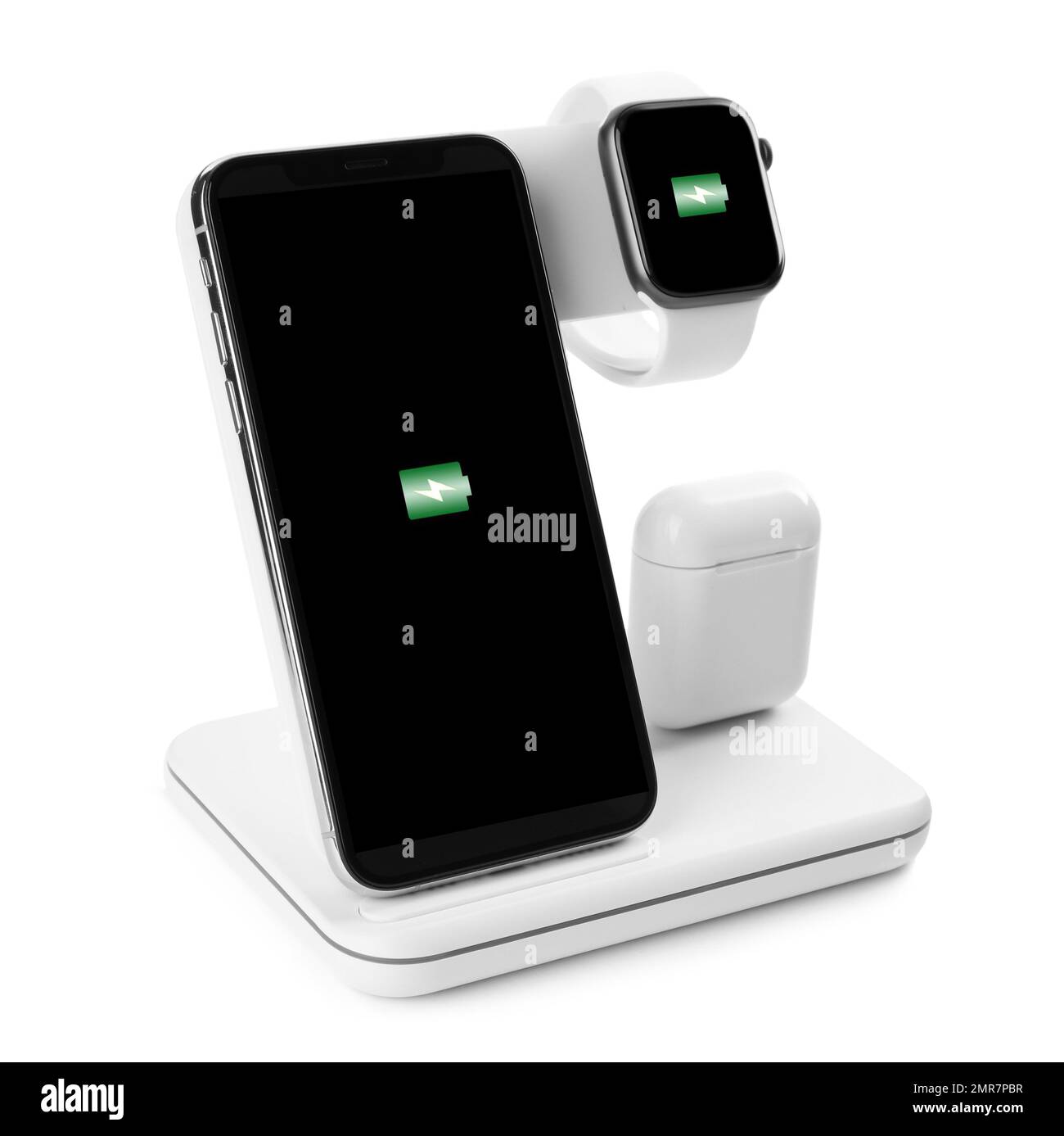 Set of gadgets charging with wireless pad isolated on white Stock Photo