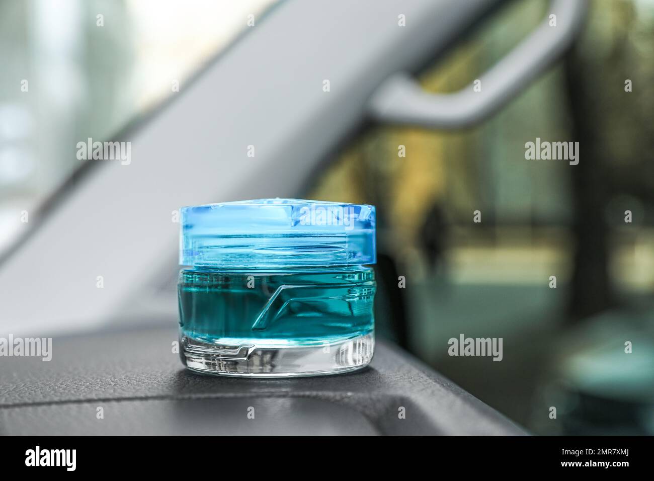 Stylish air freshener on dashboard in car Stock Photo Alamy