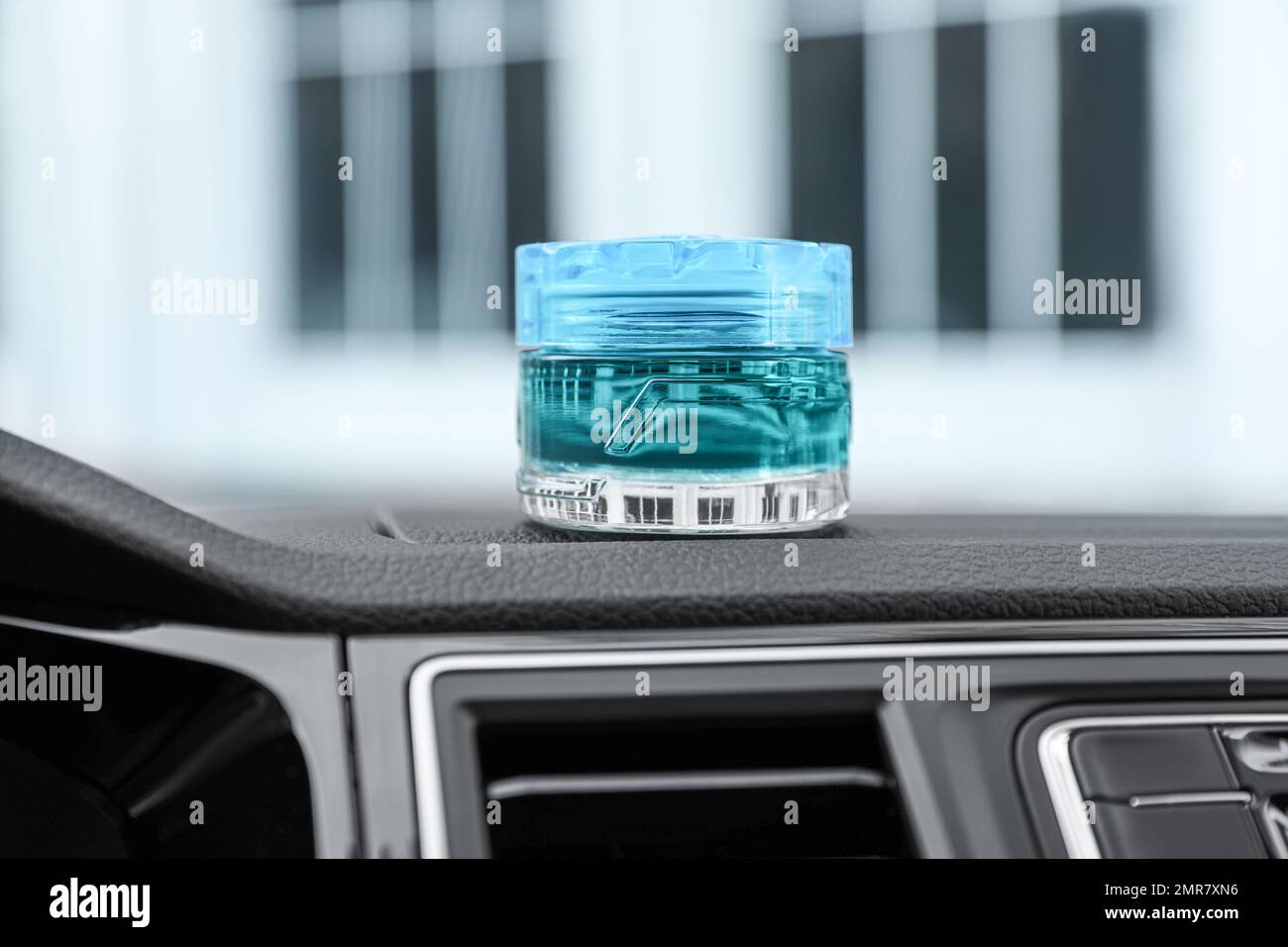 Stylish air freshener on dashboard in car Stock Photo Alamy