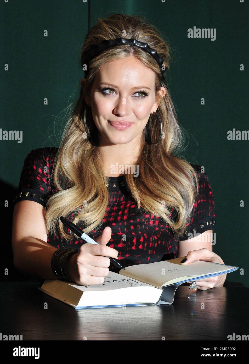 Hilary Duff signs copies of her new book "Devoted" at Barnes & Noble in New York, NY. 10th October 2011.   . Stock Photo