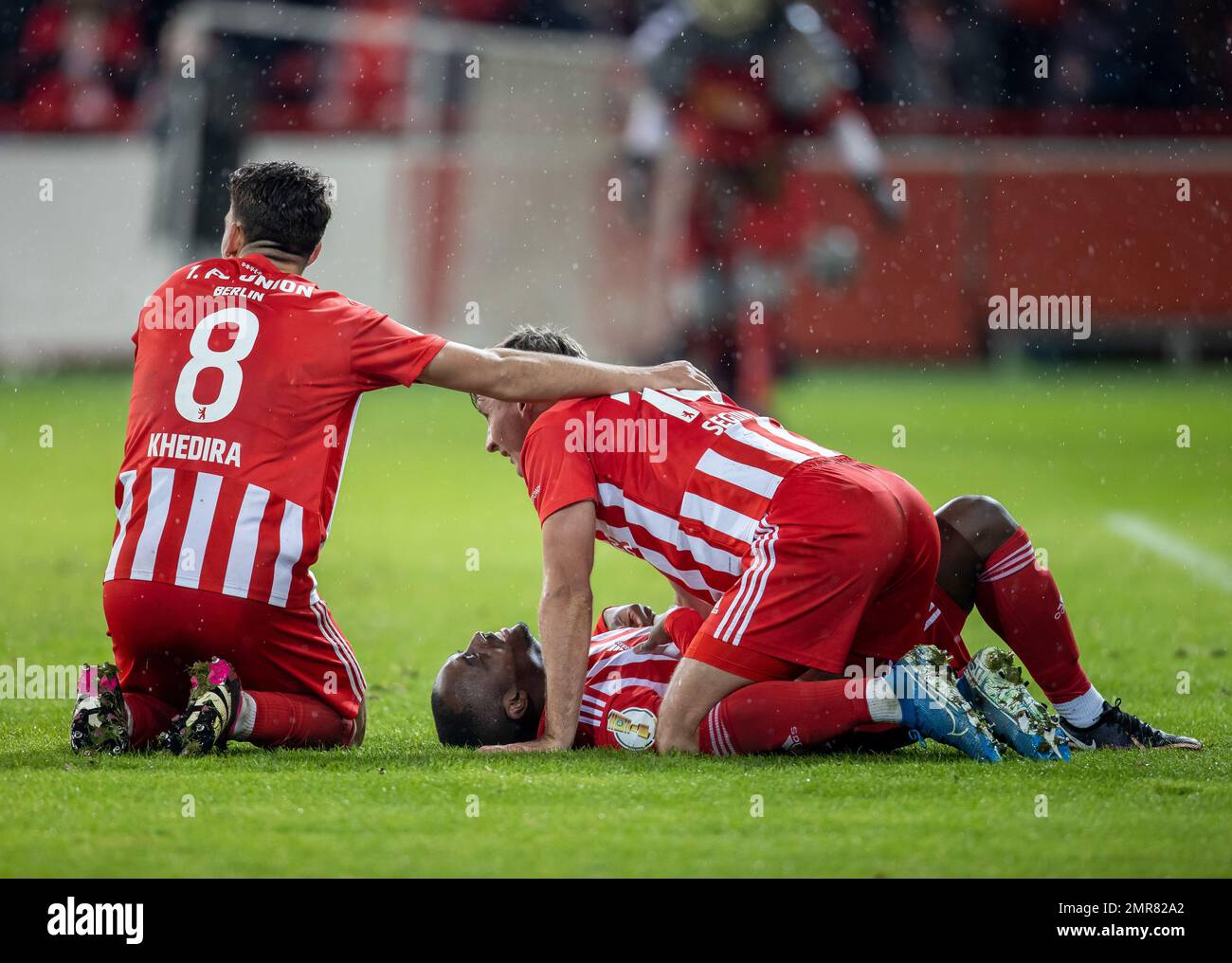 Berlin, Germany. 31st Jan, 2023. Soccer, DFB Cup, 1. FC Union Berlin - VfL Wolfsburg, Round of 16, at Stadion An der Alten Försterei. Union's Rani Khedira (l), Jerome Roussillon (u) and Paul Seguin on the pitch after the final whistle. IMPORTANT NOTE: In accordance with the regulations of the DFL Deutsche Fußball Liga and the DFB Deutscher Fußball-Bund, it is prohibited to use or have used photographs taken in the stadium and/or of the match in the form of sequence pictures and/or video-like photo series. Credit: Andreas Gora/dpa/Alamy Live News Stock Photo