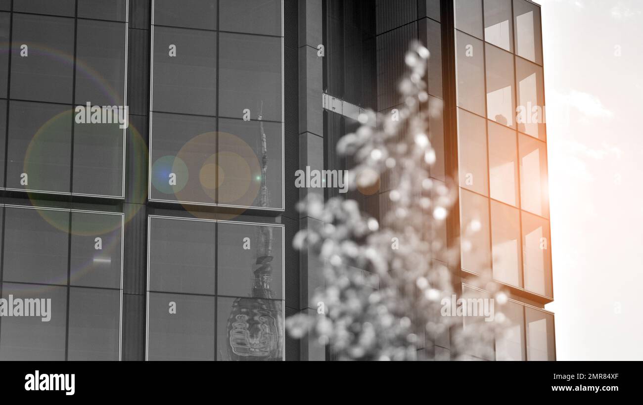 Abstract closeup of the glass-clad facade of a modern building covered ...