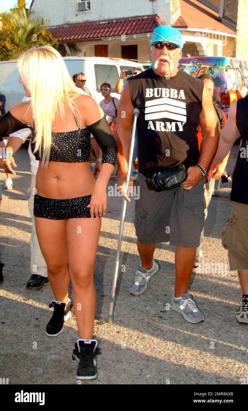 Brooke Hogan performs live during the Calle Ocho Festival in Miami's Little  Havana while her dad, Hulk Hogan (aka Terry Bollea) looks on with  girlfriend Jennifer McDaniel. After the performance, Brooke took