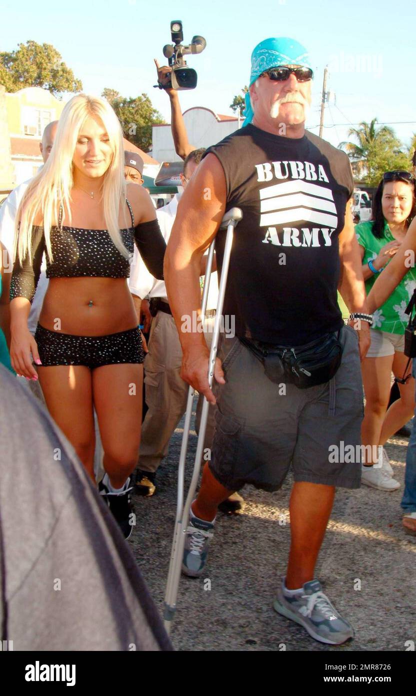 Brooke Hogan performs live during the Calle Ocho Festival in Miami's Little Havana while her dad, Hulk Hogan (aka Terry Bollea) looks on with girlfriend Jennifer McDaniel. After the performance, Brooke took some time to pose with her dad and sign autographs for fans. Miami, FL. 3/15/09. Stock Photo